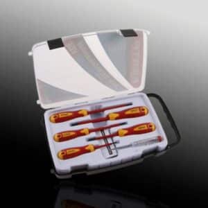 Insulated screwdriver set in plastic case on reflective surface.