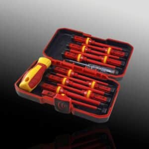 Insulated screwdriver set in case on reflective surface.