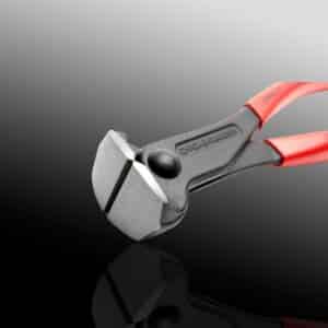 Red-handled diagonal cutting pliers on black.